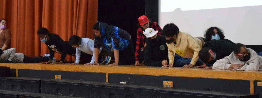 Students and teachers compete in a Push-Up Contest. 