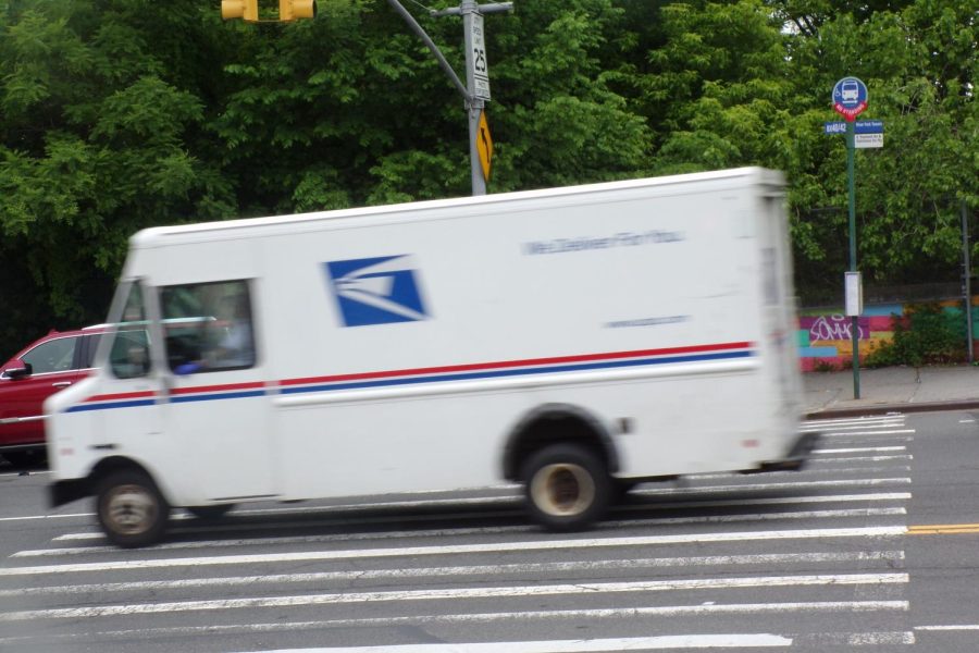 A postal truck ran through the red light in front of the school on May 20.