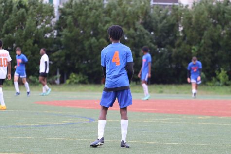 Kadeem Patterson plays defense in soccer.