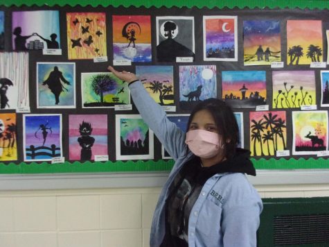 Nyla Acero shows off her vibrant drawings.