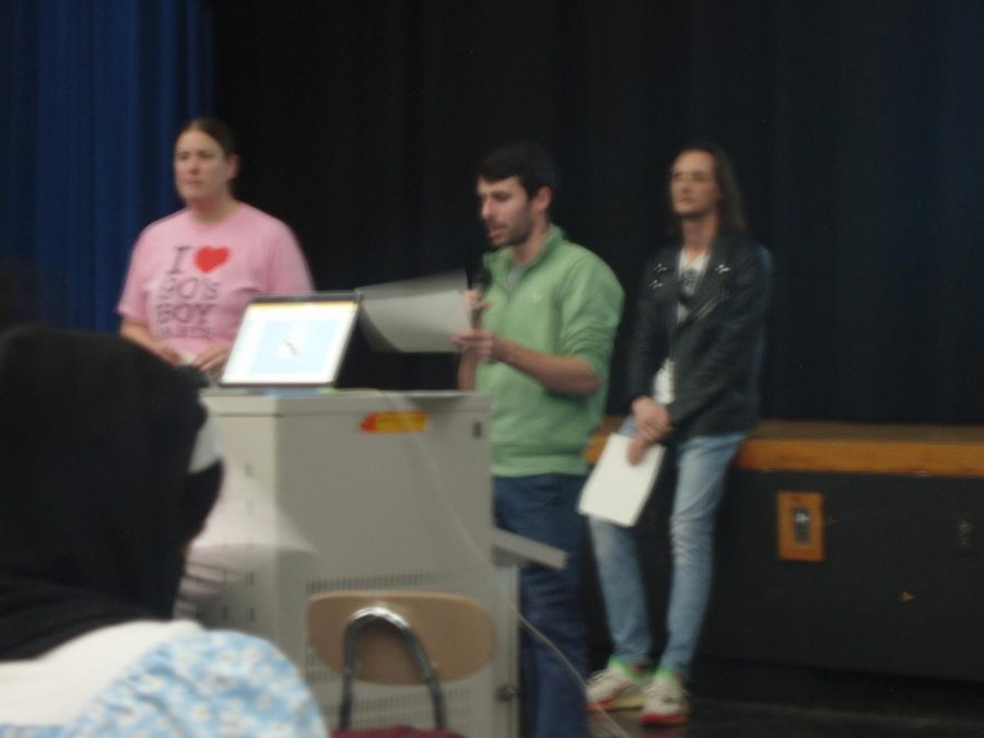 Teachers present Logic awards to students in each grade. 