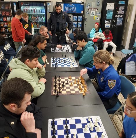 Students play chess with cops