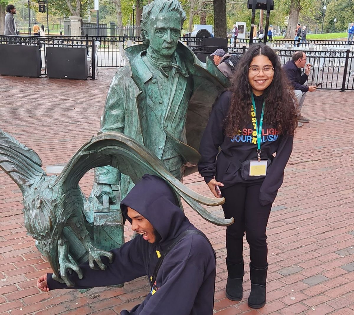 Jamal Quinones and Anastacia Vidot check out the literary symbols built into the statue of Edgar Allan Poe. 