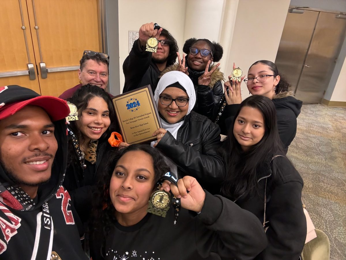 Members of the Bronx River News staff celebrate after winning two first-place awards at the Baruch College journalism conference. 