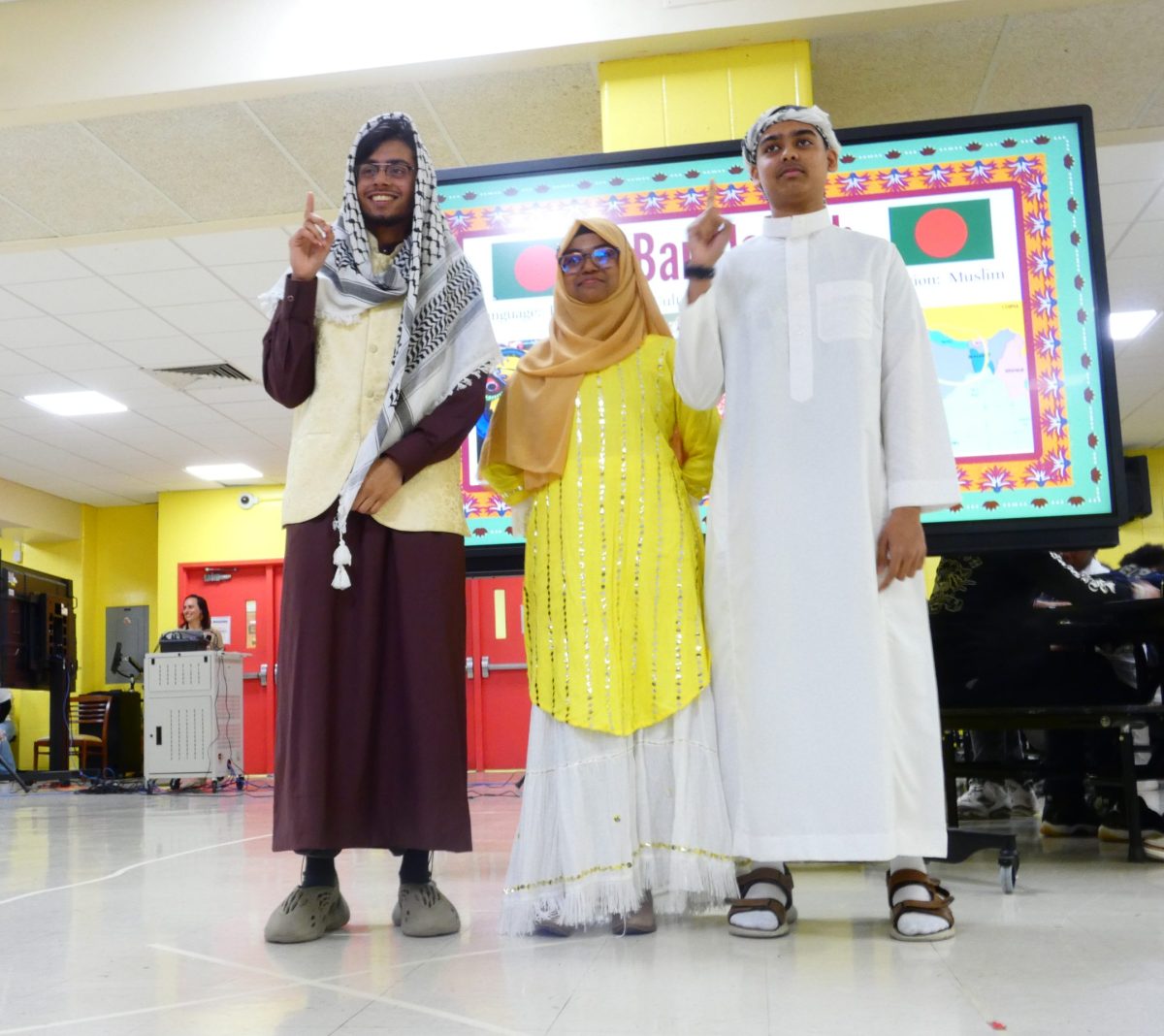 Students demonstrate Bengali cultural wear.