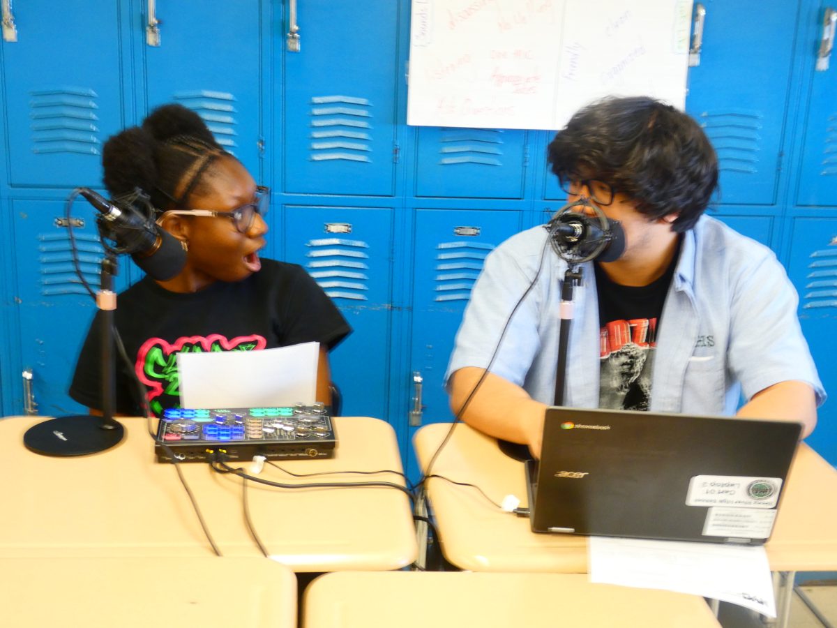 Host Cesar Jimenez and Hostess Christi-Alexis Cisse  share a funny moment during the Bronx River Podcast.