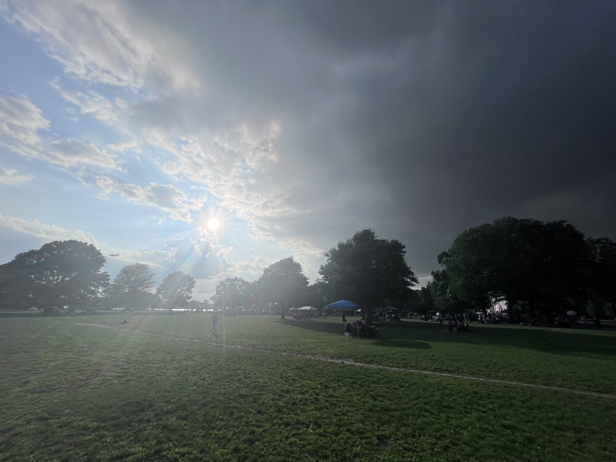 Raging cloud formation colliding with the unyielding position of the blue sky and sun.  