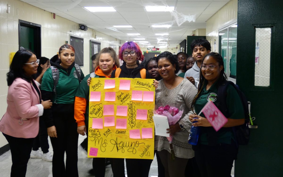 The Student Council surprises Alfa Aquino, a Spanish teacher, with a poster and a bouquet of flowers in support of her fighting breast cancer. Students in tenth grade also wrote cards  to show how much they support her.