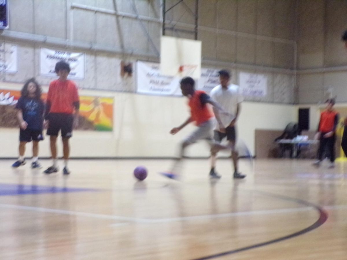 Justin Gomez scoring a goal during the upperclassmen vs. underclassmen Soccer Game