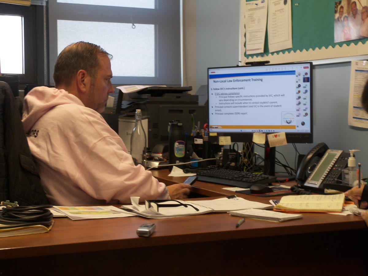 Principal Greg Fucheck takes part in a remote meeting about how to handle requests from non-local law enforcement officials to enter school buildings or seek access to students and their information.