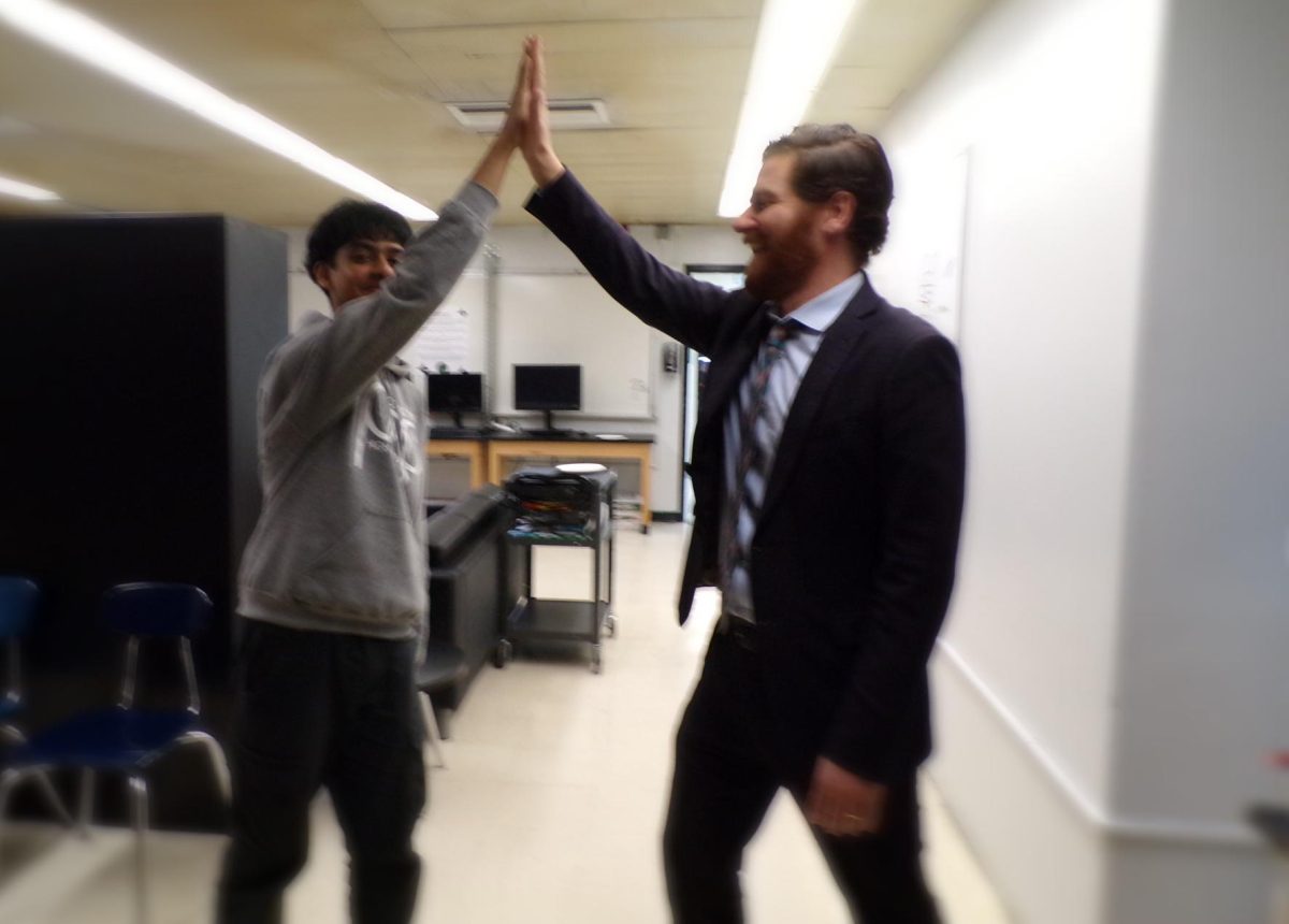  Hashan Chowdhury, vice president of the student council, and Aaden Stern, deputy superintendent, enjoy a carefree moment after a long day of meetings.