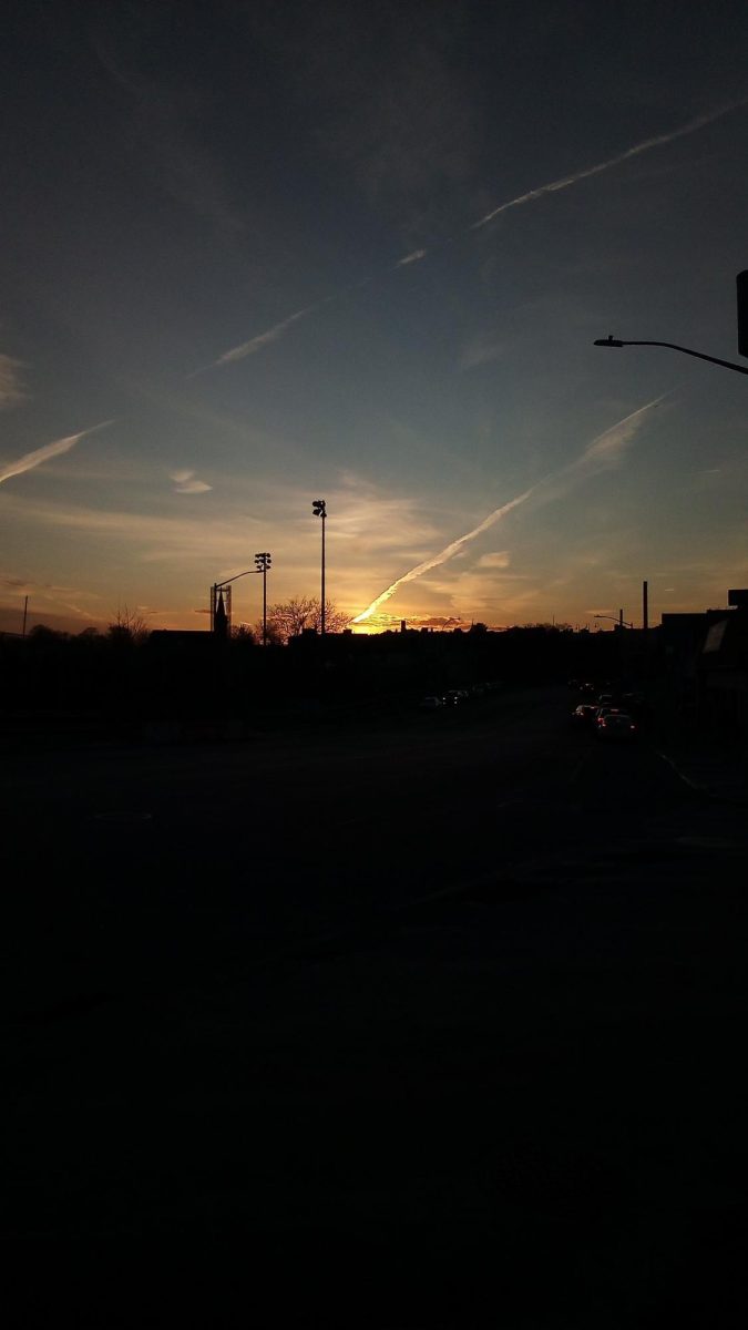 Sun glares through cloud streak imitating a beautiful Shooting star.