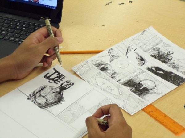 A student creates comics in the after- school art club. which meets on Thursdays. 