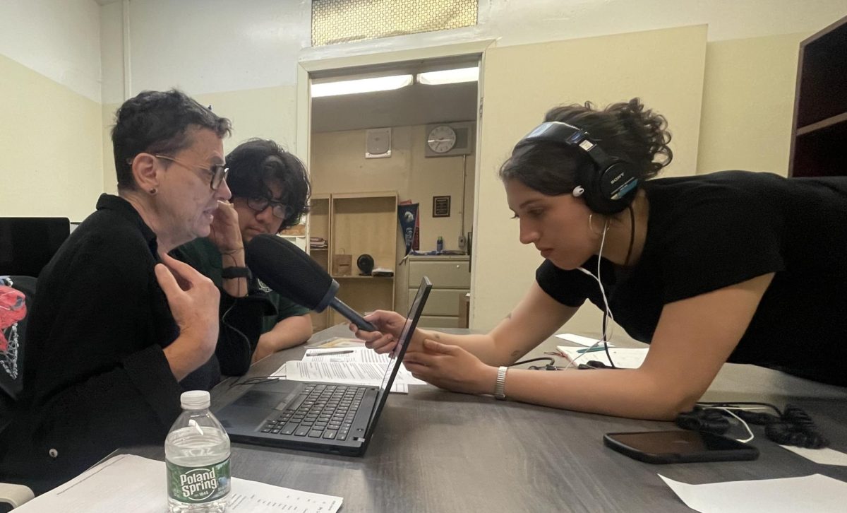 Veronica De Valle, an associate producer for "Morning Edition,'' helps Cesar Jimenez, the editor-in-chief, and Deborah Porterfield, the advisor for Bronx River News, get ready for an interview about finding the right balance between protecting students and their right to free speech.