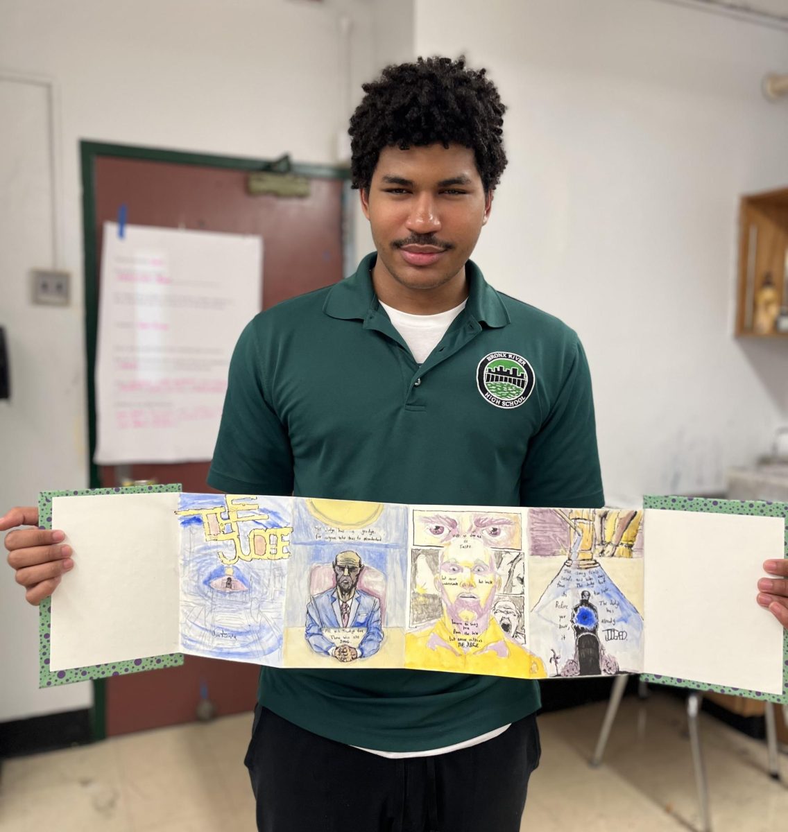 Jose Acosta shows off his art book from art class.
(Photo courtesy of Aimee Cavazzi)