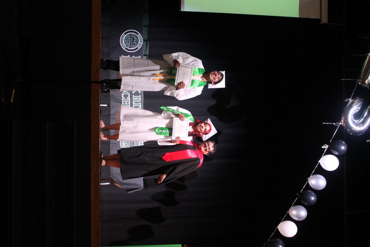 Monique Paes presented the Student Achievement Award to Alexis Santos and Jasmine Fernandez. 
