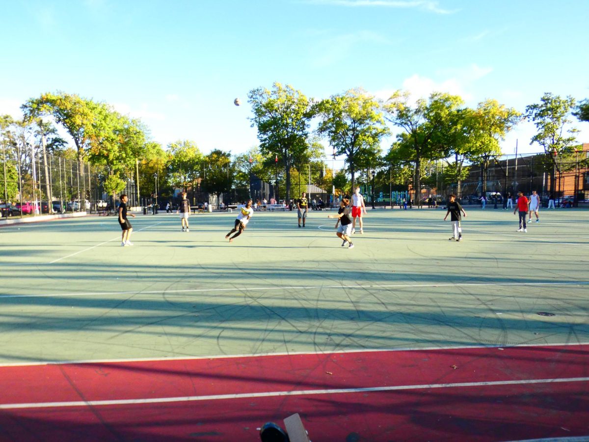 Kids playing soccer on Saturday in Loreto playground, Morris Park.