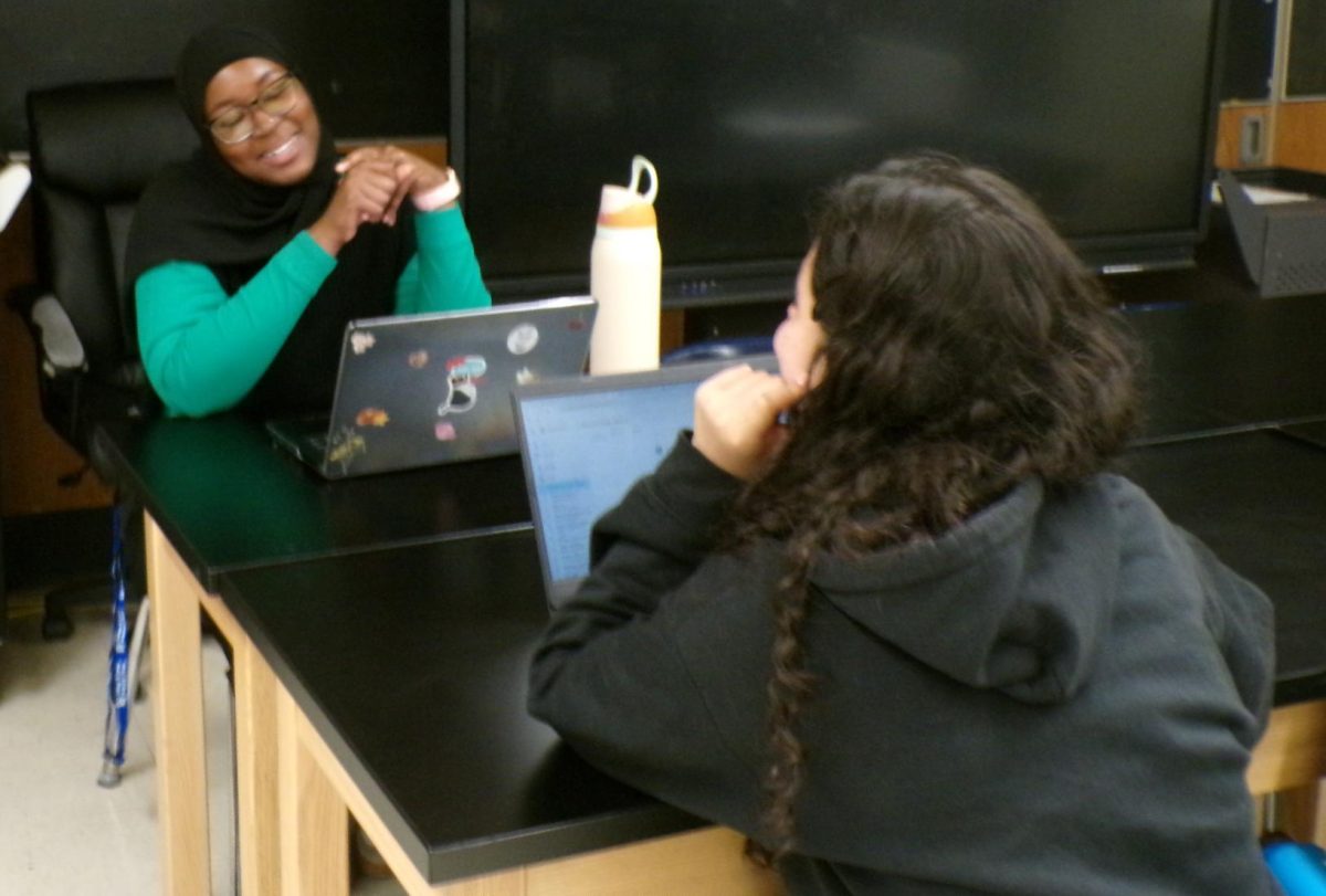 Aye Bah helps seniors navigate the college application process. 