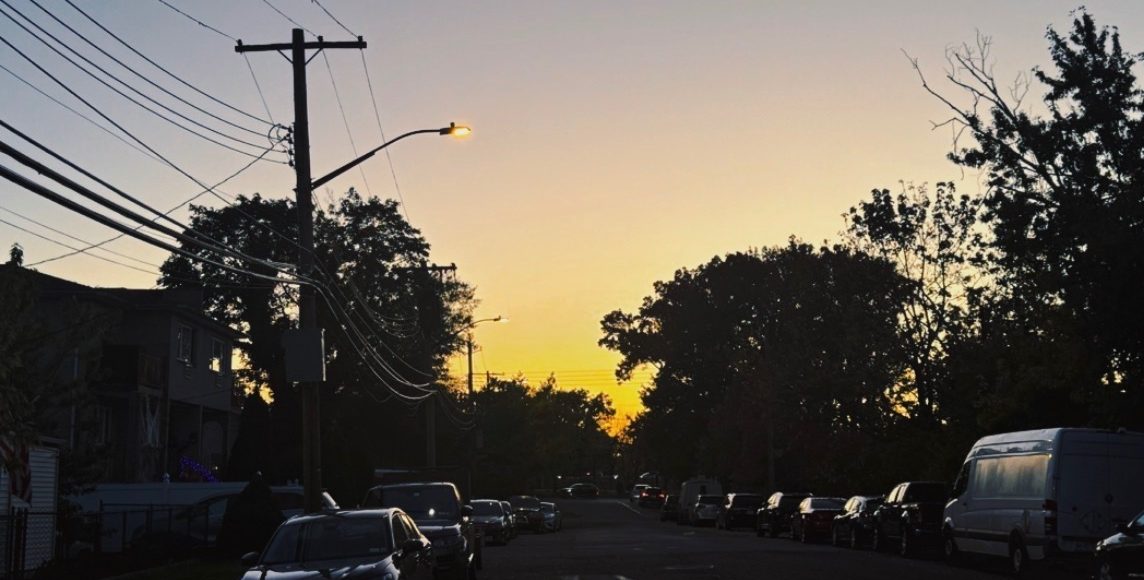 The setting sun casts the last light of the day on a fall day in the Throggs Neck section of the Bronx.
