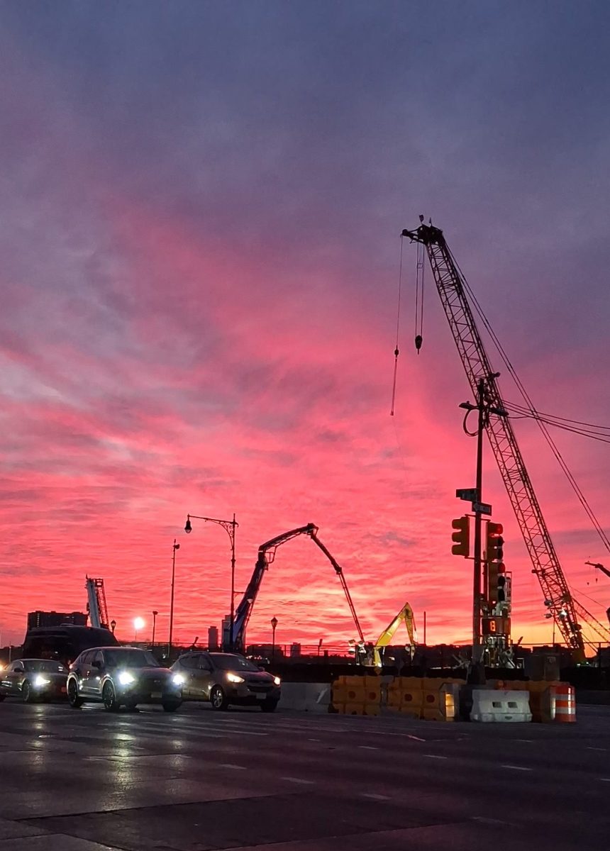 Workers in and around Hudson Yards get to experience a dark hot pink sky from Helipad 1 on West 30th Street in Manhattan.