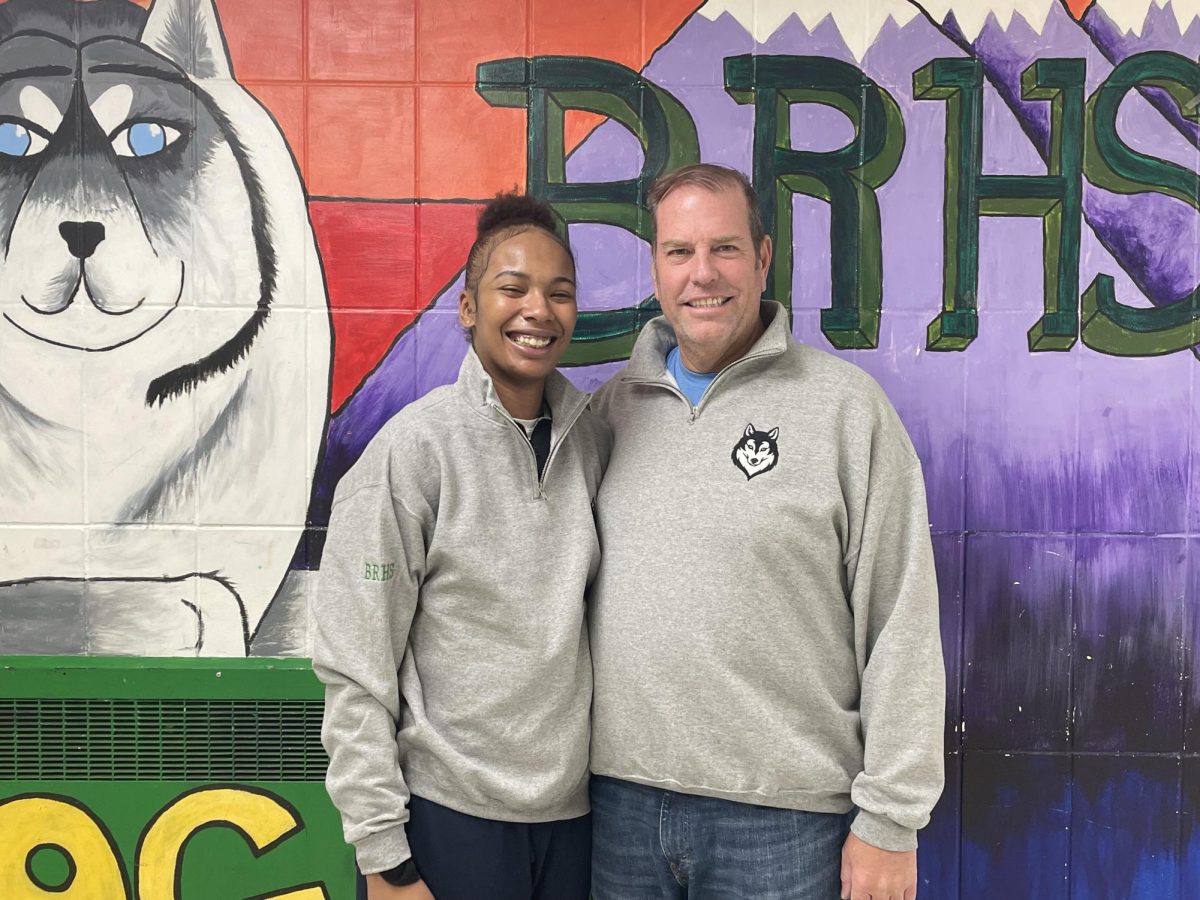Charlette Leurs, a former BRHS student and current professional basketball player, visits with one of her biggest fans, principal Greg Fucheck. 