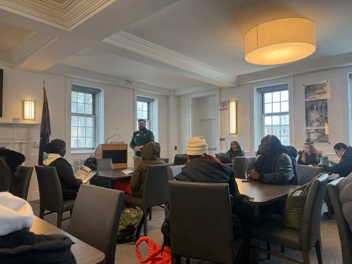 A campus advisor briefs students on opportunities and programs offered at Farmingdale State College.