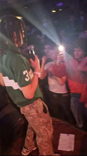 Xavier Hernandez performs in front of fans while getting attention from the crowd at a concert in Brooklyn.