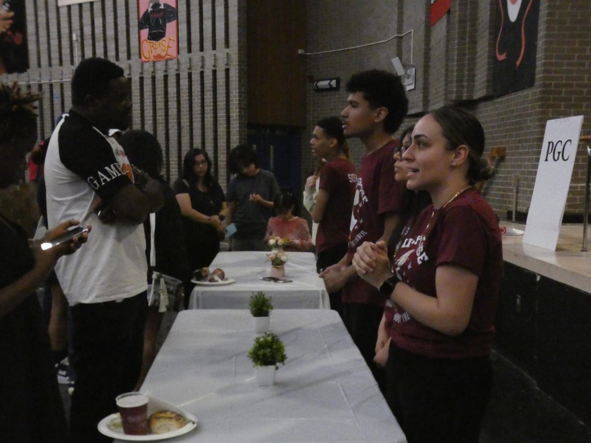 School club representatives talk to freshmen and parents about their clubs on April 18.