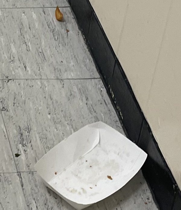 Staff and students walking the hallway after lunch have to keep an eye out for empty containers, wrappers and uneaten food left on the floor.  