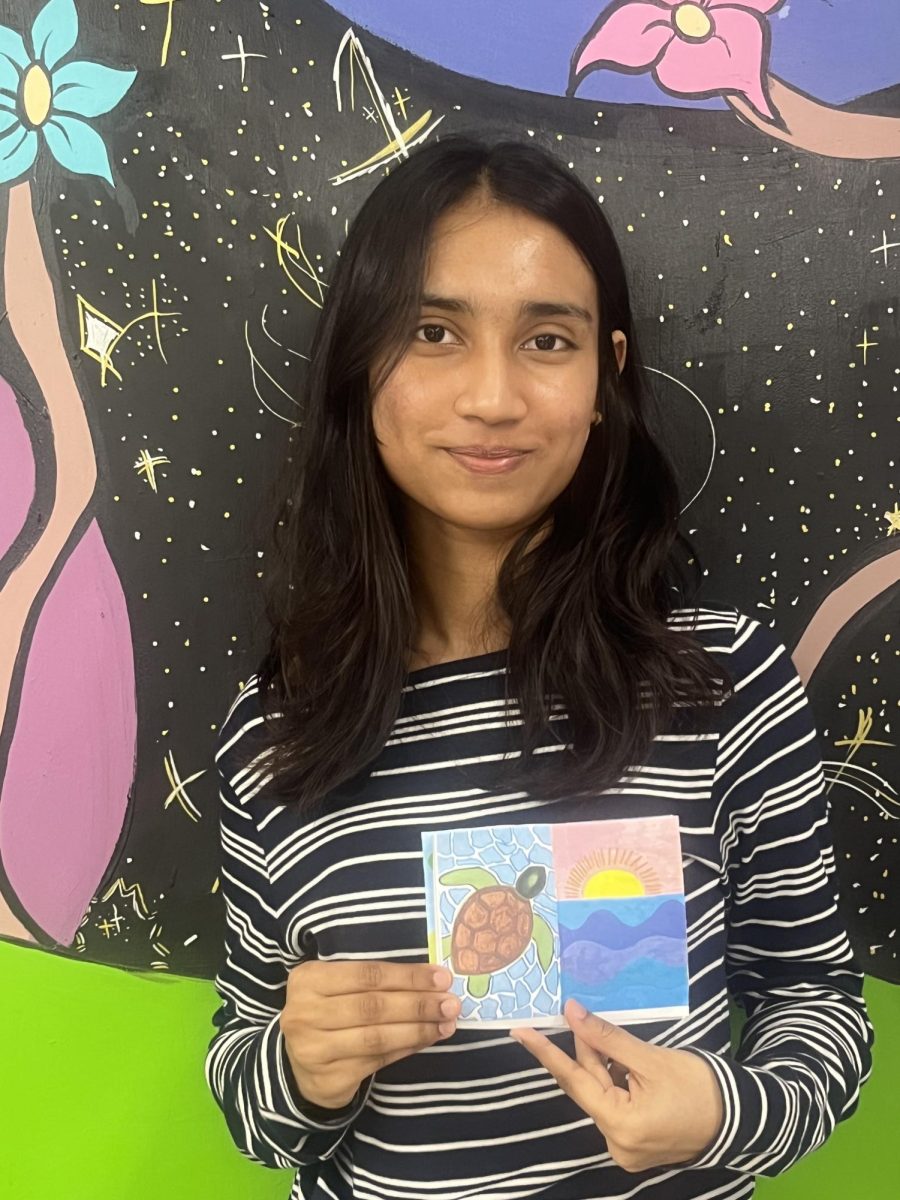 Fatema Arpa displays her spring creation. 
(Photo by Emely Navarro)