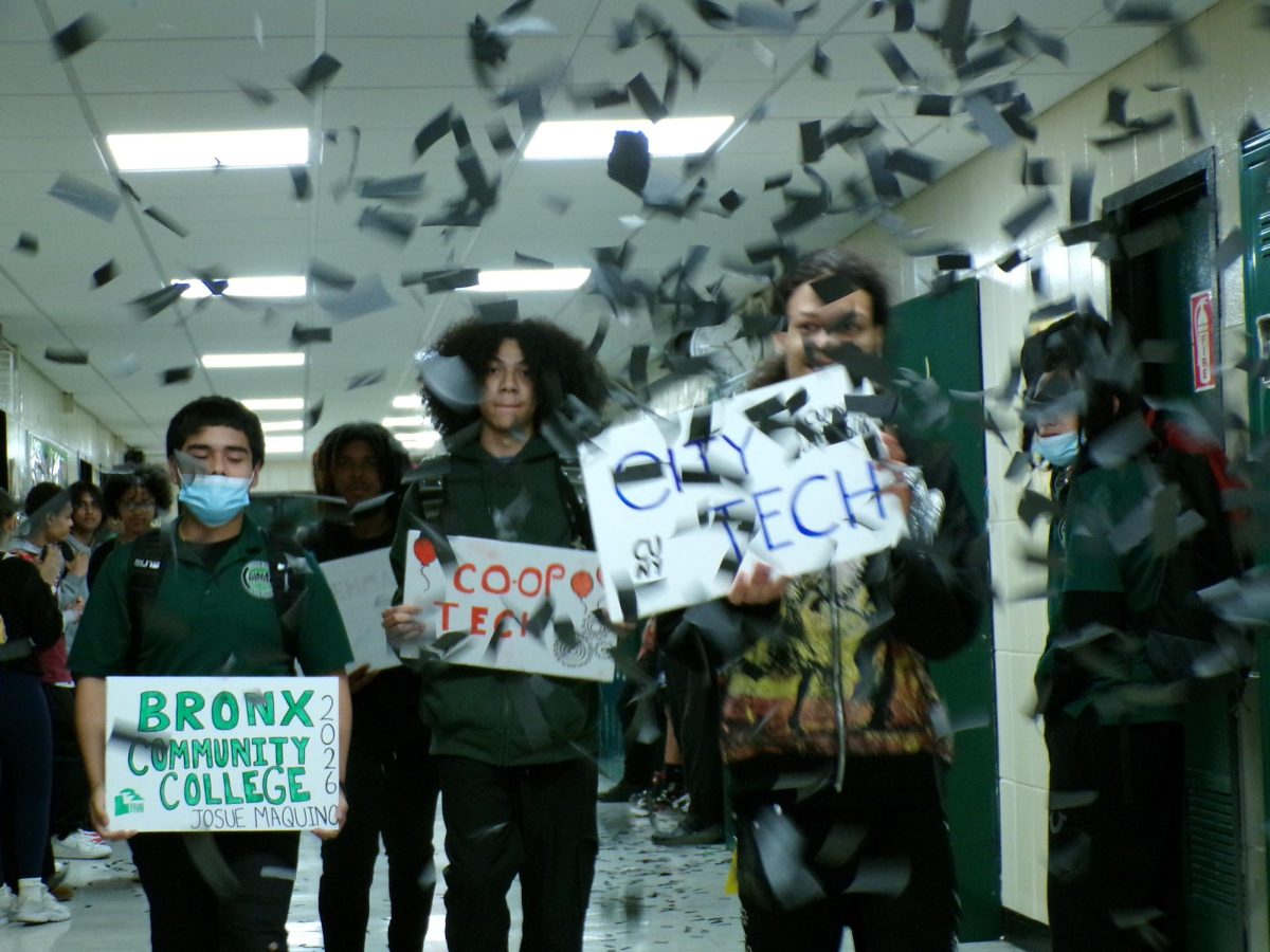 Seniors march through the hallways carrying signs announcing their post-secondary plans during a Decision Day March on May 14. 