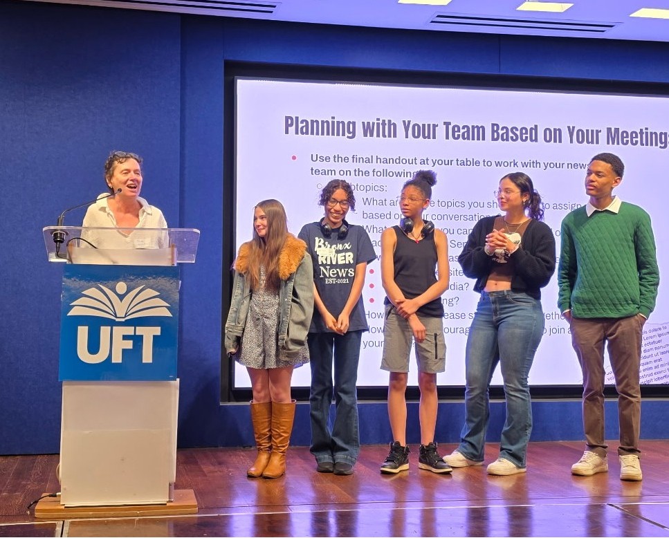 Members of the Bronx River News team join their advisor, Deborah Porterfield, on stage to accept an award at a retreat for student journalists in NYC.
(Photo courtesy of Press Pass NYC)