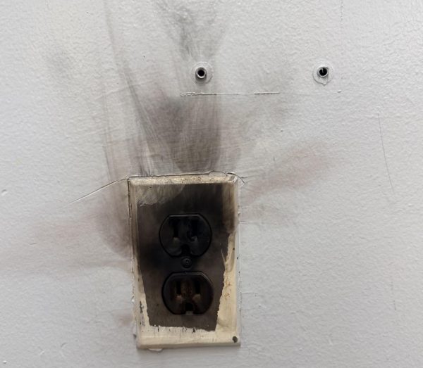 An old electrical outlet in Room 453 caught fire during a global studies class. 